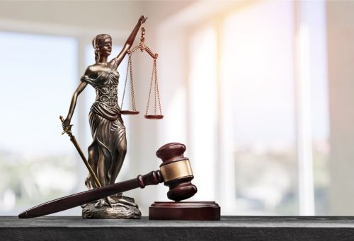 scales of justice and gavel - post conviction attorney concept