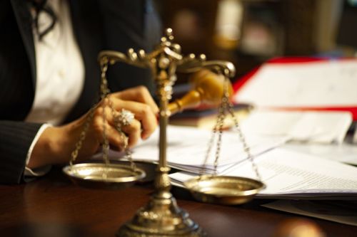scales of justice sitting on desk with paperwork - direct appeal concept